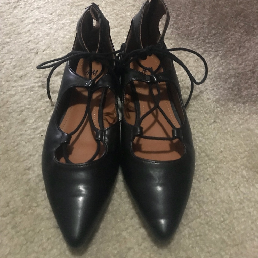 Pointy black with laces! Almost new wore it once